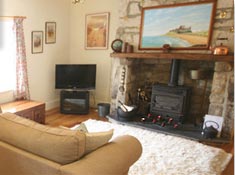 Lounge at Eider Self-catering Cottage in Warren Mill, Northumberland, UK