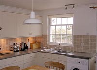 Kitchen at 10 The Wynding, self-catering cottage in Bamburgh  Village, Northumberland, UK